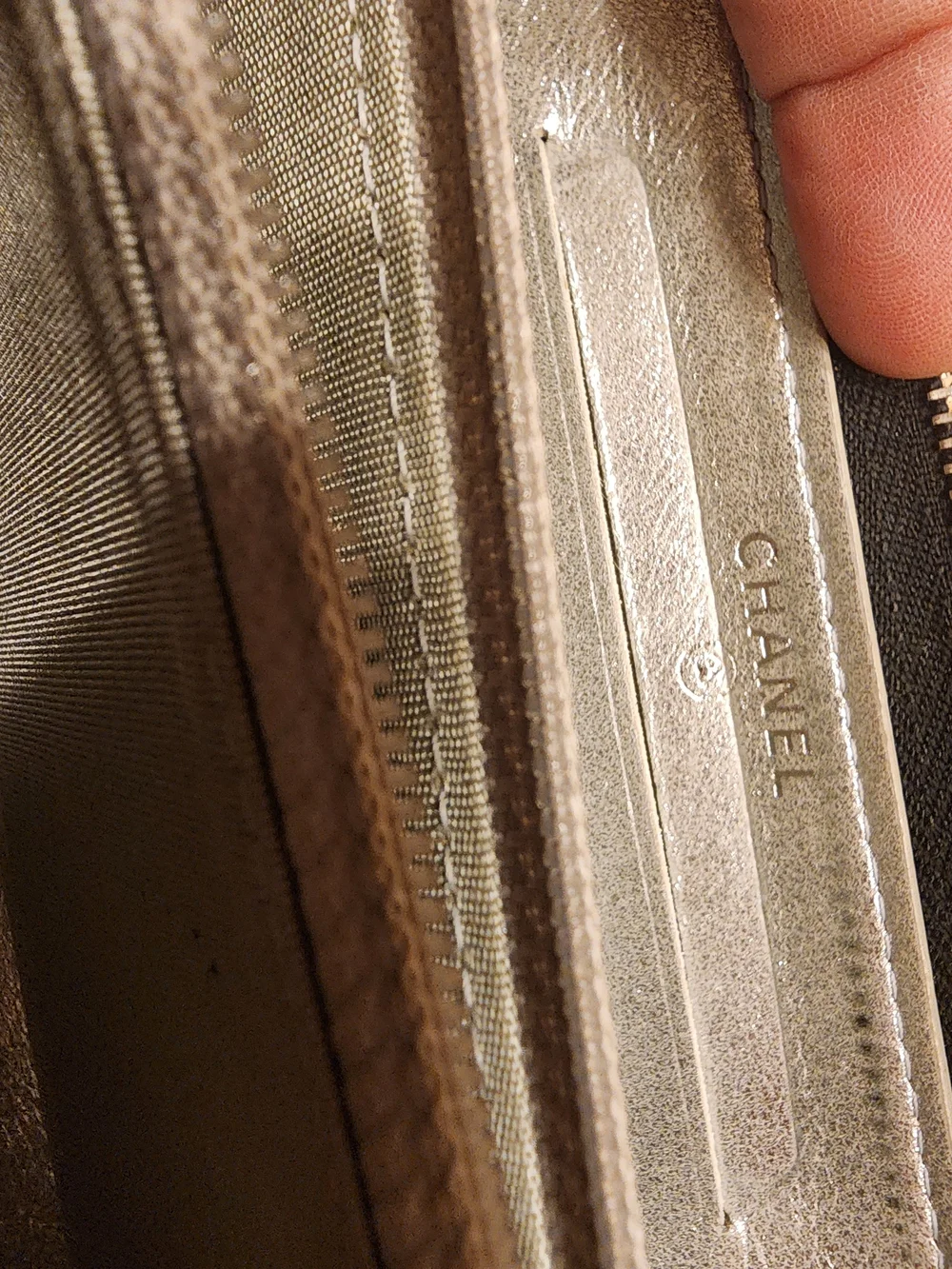 Chanel Timeless CC zip-around wallet features smooth black leather